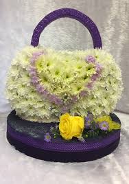 Check spelling or type a new query. Unusual Tributes Hand Bag Fleurtations Flowers