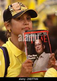 Opposition presidential candidate Corazon Aquino waves back at the crowd  shortly upon arrival for a campaign rally in Koronadal, 625 miles southeast  of Manila, Jan. 20, 1986. Mrs. Aquino and her vice