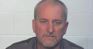 Hamann charged in wife's death