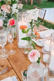 Bud Vases And Pillar Candles On Farm Table Blush Floral Design Emily Tebbetts Photograph Farm Table Wedding Bud Vase Centerpiece Bud Vase Centerpiece Wedding