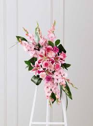These memorial flowers are sent to a funeral home or cremation place to be displayed next to the coffin, or in case of coffin sprays, on top of it. The Ftd Sweet Farewell Standing Spray Richmond Hill On Florist