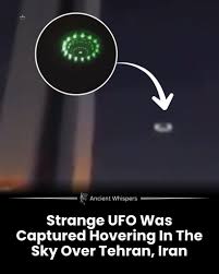 A strange and mesmerizing sight recently unfolded in the skies above  Tehran, Iran, when an unidentified craft appeared hovering near the  towering silhouette of the iconic Milad Tower. The object's glowing aura