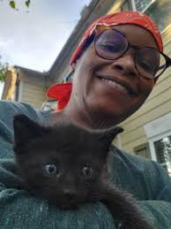 Kitty naps in daddy's undershirt like her human