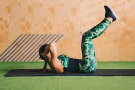 Download Young Woman Doing Abs Workout In A Gym On A Mat For Free Abs Workout Abs Workout For Women Abs Workout Video