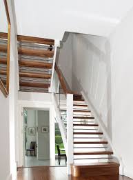 The white and glass staircase gives the perfect illusion that you have managed to create more light and space in your home. Walnut And White Stairs With Glass Stairs Ireland