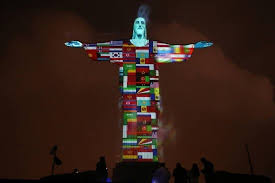 Cristo Redentor, Brazil. Last night, with the flags of all the countries  going through the pandemic. : r/pics