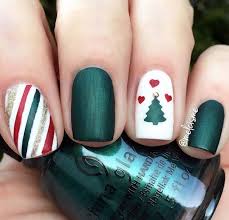 50 Insanely Cute Christmas Nails That You Need To Try This Year Paint your nails white and then draw little black lines on them, and paint little christmas lights so that it looks like the black line is a string of christmas lights.