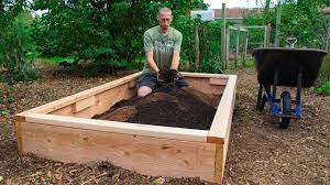 Using a trellis or arbor with a raised bed makes it even easier to harvest vegetables and keeps them neater than if they were sprawling on the ground. How To Build A Raised Bed Cheap And Easy Backyard Gardening Youtube