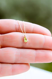These are most often rendered in precious metals such as gold, silver, and platinum. Green Peridot Gold Necklace9k14k18ksolid Gold Etsy Peridot Necklace Peridot Jewelry Heart Shaped Diamond Pendant