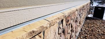 Proper flashing around a chimney includes two layers. Stone Veneer Problems The Inside Story To Manufactured Stone Siding
