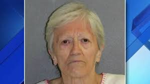 Woman threatened neighbor with shotgun over cat, police say