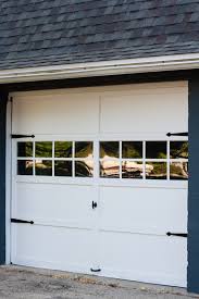 I was thinking of eventually installing real carriage doors on my garage (not painting/adding veneers to the existing overhead door). Garage Door Makeover The Lilypad Cottage
