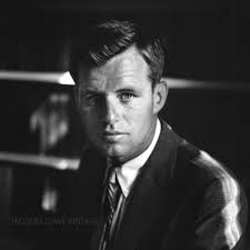 Robert F. Kennedy (Bobby) is captured in a dramatic and intense portrait by Jacques  Lowe. His gaze is serious, emphasizing the deep sense of responsibility and  determination that characterized his work. The