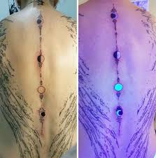 30 Glow In The Dark Tattoos That Ll Make You Turn Out The Lights Black Light Tattoo Uv Tattoo Violet Tattoo