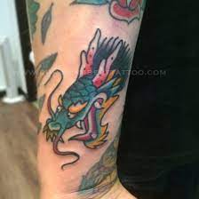 Small Traditional Dragon Head Tattoo By Chris Lambert Done At Snake And Tiger Tattoo Leed Dragon Head Tattoo Traditional Dragon Tattoo Snake And Tiger Tattoo