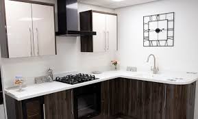 It does not have any hardware on the doors or drawer fronts because they have push to open hardware. Kitchens Bolton Bury Dream Doors Showroom
