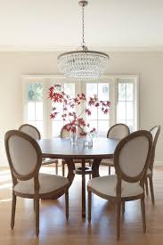 This dining set constitutes a great. Round Dining Table With Vintage French Round Fabric Side Chairs Transitional Dining Room