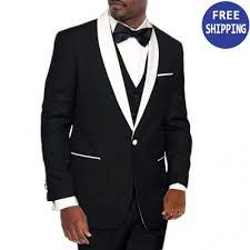 A white tuxedo jacket, with black tuxedo pants. Slim Fit Tuxedo Black With White Shawl Lapel One Button Prom Wedding Perfect Tux