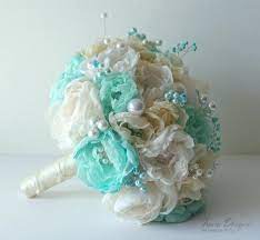 Purple, jade, turquoise, and teal bouquet with peacock feathers. Handmade Fabric Brooch Bouquet Turquoise And Ivory Wedding Bouquet Fabric Flowers Bouquet Bridal Bouquet Fabric Flower Bouquet Fabric Bouquet Ivory Bouquet Wedding