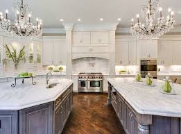 Beautiful Kitchen With White Cabinets Two Islands Two Chandeliers And Carrara Marble Countert Beautiful Kitchens Gourmet Kitchen Design Interior Design Kitchen