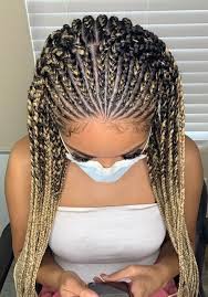 A popular hairstyle is two long feed in braids; Qs Braids 3 Layer Feed Ins Mid Back Medium Spacing