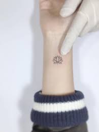 117 Of The Very Best Flower Tattoos Tattoo Insider Flower Wrist Tattoos Small Wrist Tattoos Lotus Tattoo Wrist