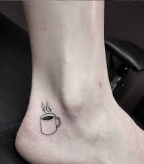 Dainty rose on index finger. 230 Amazing Coffee Tattoo Designs With Meanings Ideas Celebrities And Surprising Facts Body Art Guru
