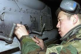 SENIOR AIRMAN (SRA) Scottie Odani, USAF, 25th Fighter Squadron (FS),  prepares to remove an ejector rack from an A-10 Thunderbolt II pylon during  Exercise BEVERLY BULLDOG at Osan Air Base, Republic of