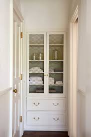 Source 3 North Entry To Bathroom Features Built In Linen Cabinet With Chicken Wire Doors Accented With Antique Brass Home Small Linen Closets Hallway Cabinet