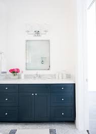 Grey and white bathroom remodel with carrara marble herringbone tile tile, white vintage tub and blue accents. Navy Washstand With Carrera Marble Countertop Transitional Bathroom Benjamin Moore Hale Navy Navy Bathroom Navy Blue Decor Home