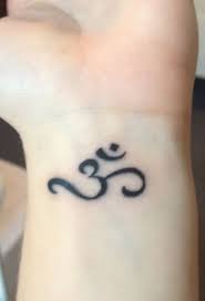 Amazing black ink trishul with pellet drum tattoo on forearm. Wrist Shiva Tattoo Small Elegant Arts Tattoo