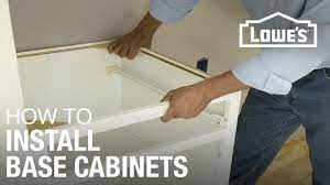 Place the corner cabinet into position on the wall stud marking. How To Install Base Cabinets Youtube
