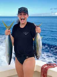 The wife's first ocean fish! She wanted to hold my tuna to show hers was  bigger lol : rFishing
