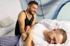 Gay couple tickling each other in bed stock photo (221421) - YouWorkForThem