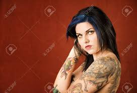 Back in time, it was assumed that a woman with a tattoo is bad and of a low character but now it has completely changed and society has accepted that getting a tattoo for a woman is not a bad thing anymore. Pretty Young Woman With Many Colorful Tattoos Stock Photo Picture And Royalty Free Image Image 3454440