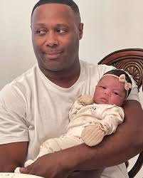 Micha Stampley and his new granddaughter. Y'all show him some love