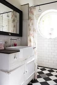 This bathroom boasts a beautiful black tile on a single wall, which can feel dark in an enclosed space. Black And White Tile Bathroom Images Novocom Top