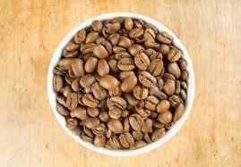 Light Roast Brown Coffee Beans In A White Bowl On A Wooden Table Stock Photo Picture And Royalty Free Image Image 96225140