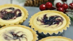 Blueberry cheese tart is made with crisp pastry, filled with rich cream cheese filling and top with blueberry filling. Blueberry Cheese Tart Plated Asia