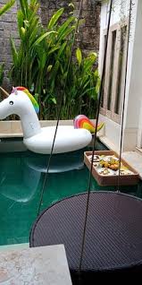 Floating Breakfast On The Pool Our Rented Unicorn Floaties And The Superb Heavenly Rattan Swing Picture Of Ini Vie Villa Legian Tripadvisor