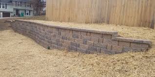 This should fill the bottom two layers of block to a depth of 8. Professional Retaining Walls Kansas City Mo Complete Hardscapes