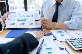 business businessman in meeting analyses chart graphy marketing