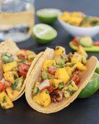 We loaded the tortillas with fish, avocado, mango salsa, red cabbage, and cilantro and sat down to enjoy. Mahi Mahi Fish Tacos With Chipotle Mango Salsa Half Baked Harvest