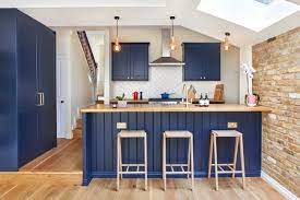 Blue kitchen dark wood floor. 8 Flooring Ideas To Team With Your Dark Blue Kitchen Houzz Ie