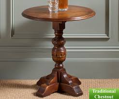 Beautifully crafted from the finest character oak combined with a warm tudor brown traditional finish contrasted with beautifully crafted turned carvings from that period which is antiqued to give the authentic look. Old Charm Classic 2428 Wine Table Occasional Rg Cole Furniture Limited