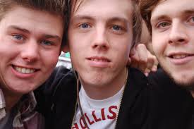 I imagine you wouldn't call this street photography, however I was at  Bingley Music Festival several years ago with my camera, looking for  interesting shots when these three these lads stood right