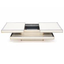 Shop our best selection of natural color coffee tables to reflect your style and inspire your home. Rizzo Willy A Rare Coffee Table Of Chromed Brass And Creme Coloured Laminate Mutualart