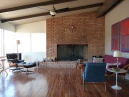 This stunning fireplace was constructed from reclaimed wood, adding a big dose of warmth and drama, while staying true to the rustic, shabby chic style of the room. Mid Century Modern Fireplaces Whaciendobuenasmigas