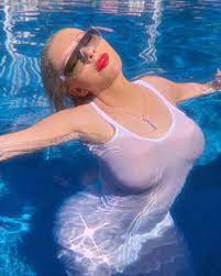 Busty Christina Aguilera shows off her assets in a pool while wearing a  white see-through T-shirt dress | The US Sun