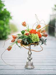Orange Signifies Enthusiasm And Passion The Floral Arrangement Made Of Tulips Hydrangeas Roses And Seeded Eucaly Flower Supplies Floral Arrangements Tulips